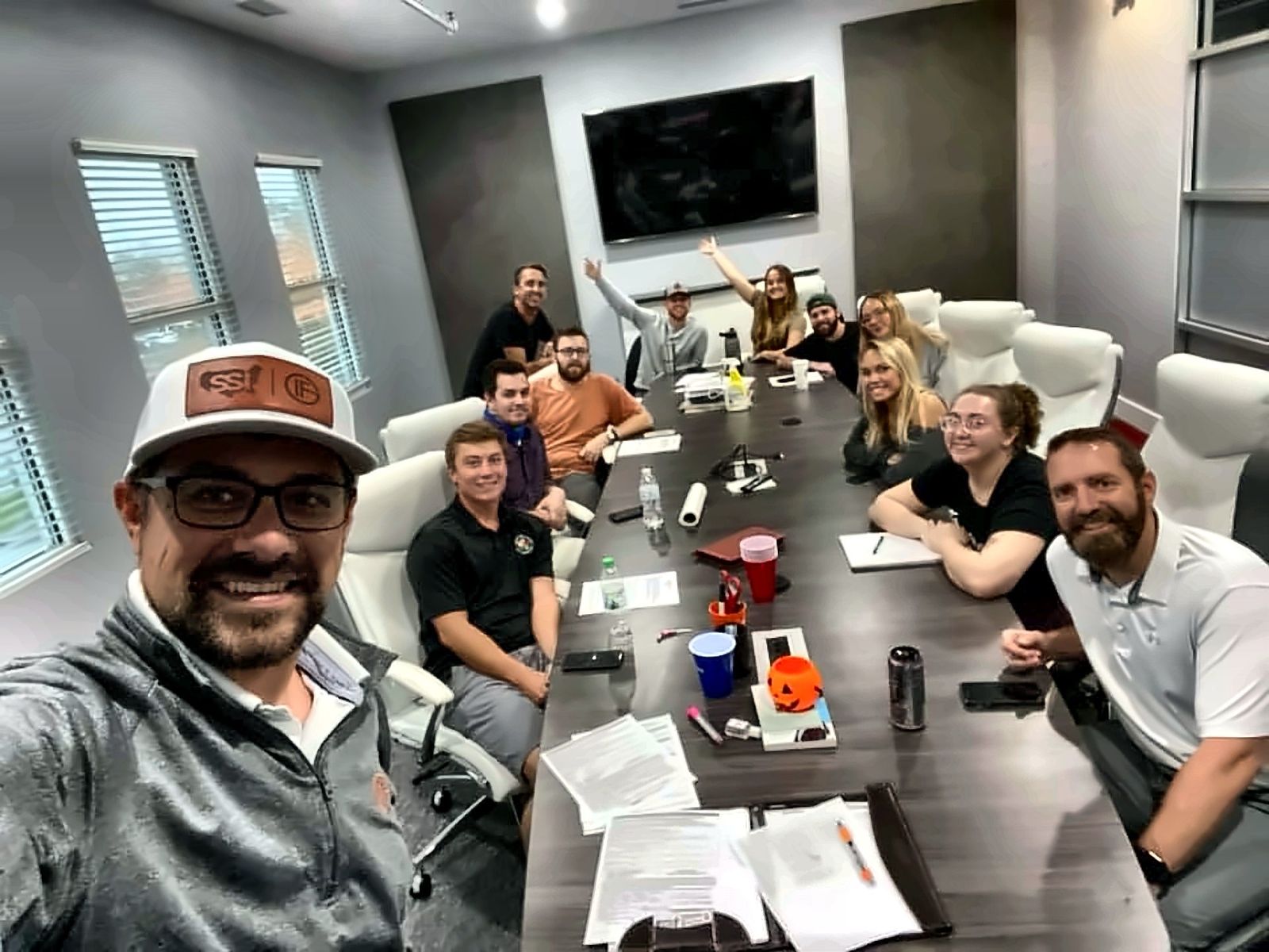 The Senior Solutions Insurance team around the conference table in their Greenwood Village office